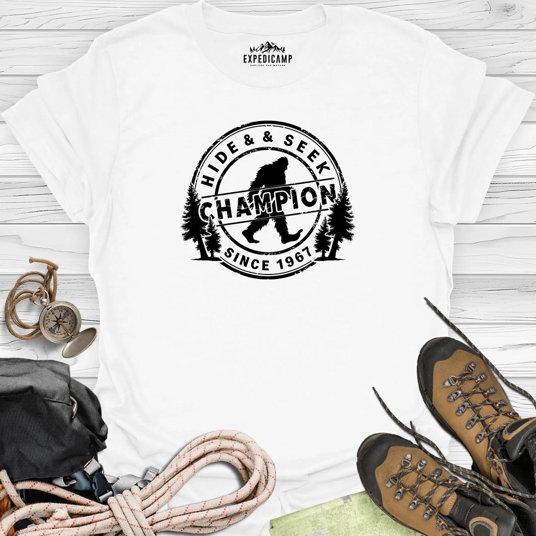 Bigfoot Hide And Seek World Champion SINCE 1967 T-Shirt – White – Outdoor apparel for travel, hiking, camping, and nature lovers – ExpediCamp