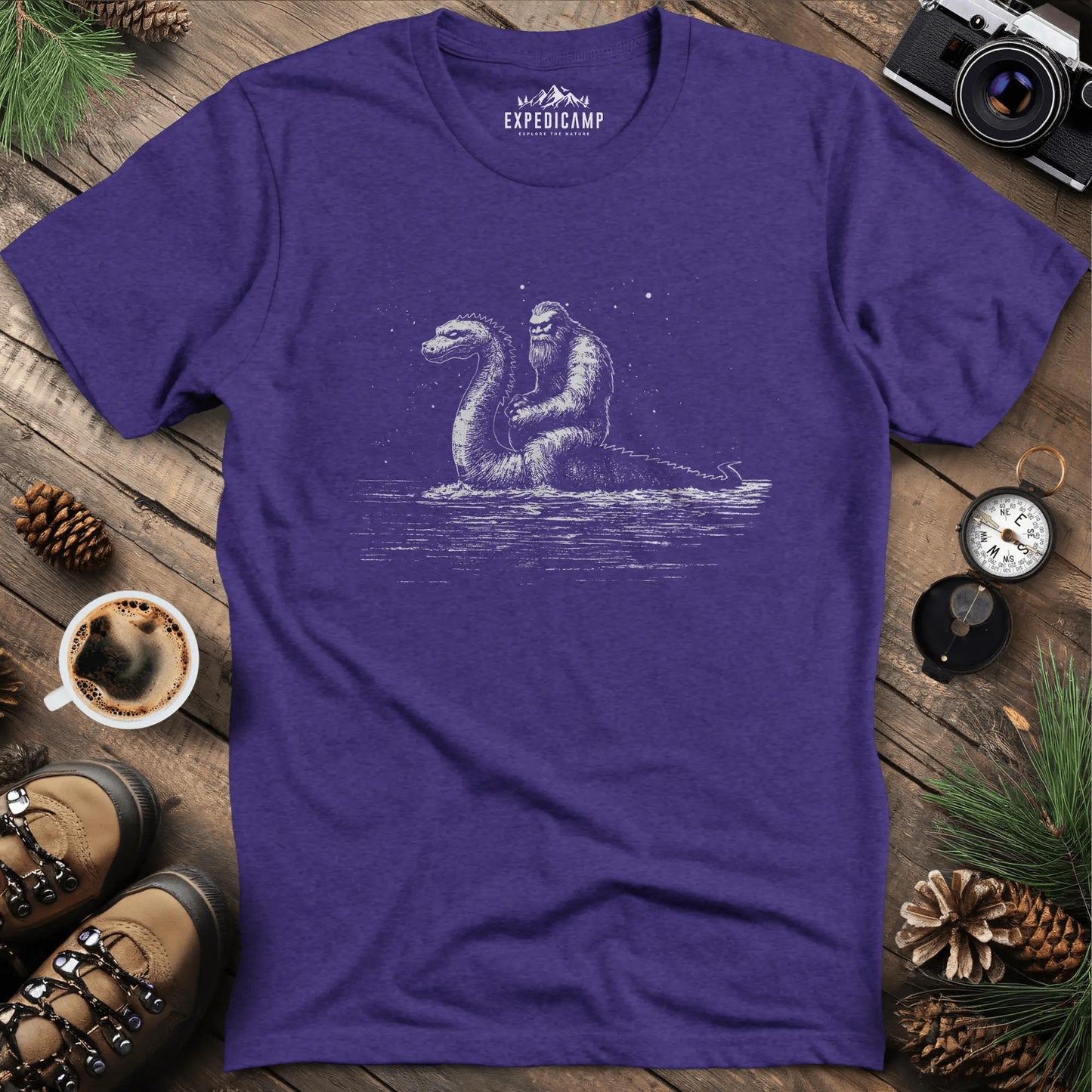Bigfoot Riding Loch Ness Monster T-Shirt – Heather Purple – Outdoor apparel for travel, hiking, camping, and nature lovers – ExpediCamp