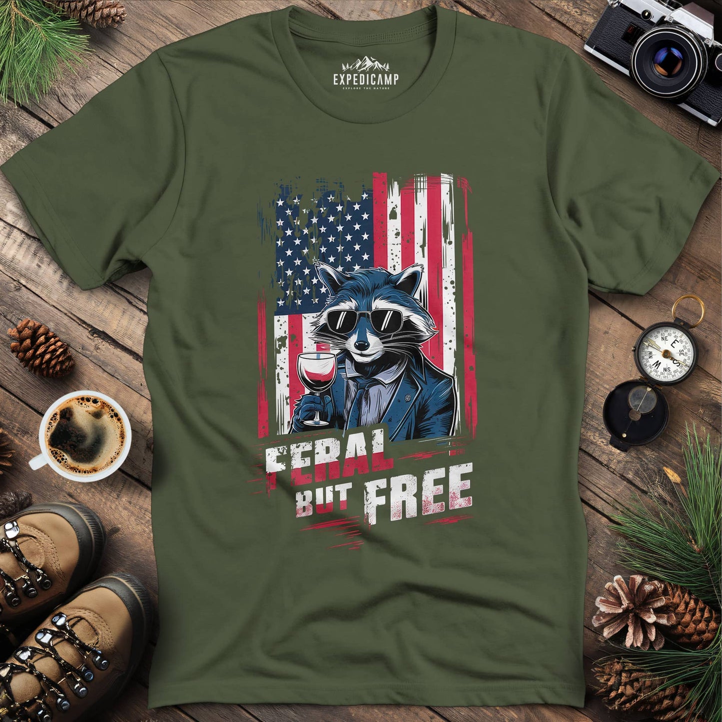 Feral But Free Patriotic Raccoon T-Shirt – Military Green – Outdoor apparel for travel, hiking, camping, and nature lovers – ExpediCamp