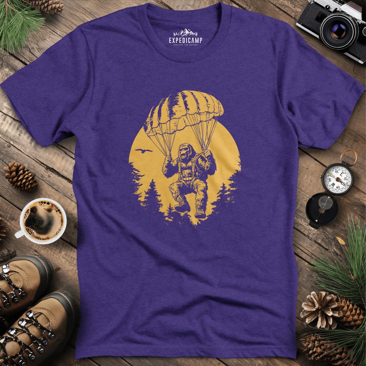 Parachuting Bigfoot T-Shirt – Funny Bigfoot Adventure Design – Heather Purple – Outdoor apparel for travel, hiking, camping, and nature lovers – ExpediCamp