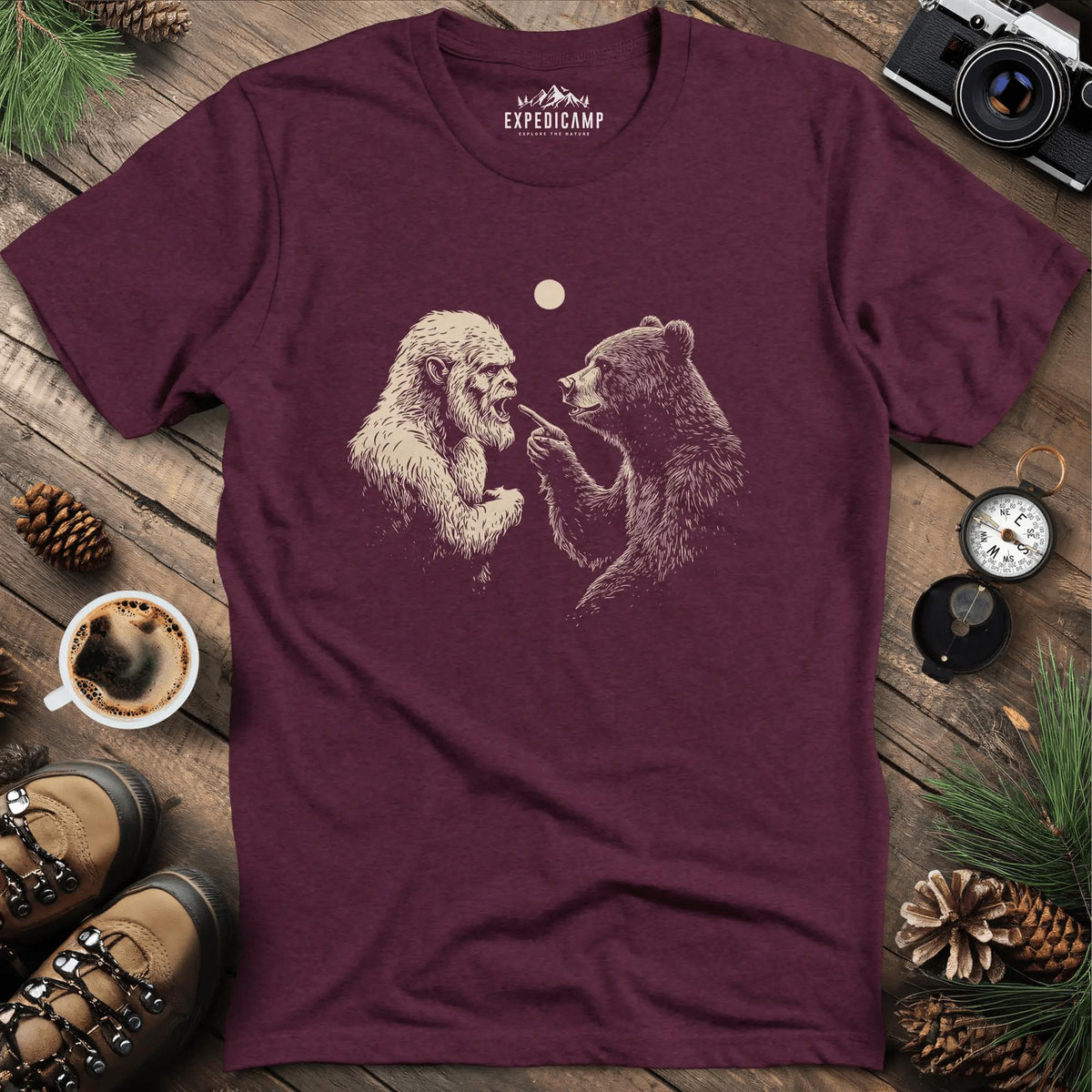 Bear and Bigfoot Argument T-Shirt – Wilderness Debate – Heather Maroon – Outdoor apparel for travel, hiking, camping, and nature lovers – ExpediCamp