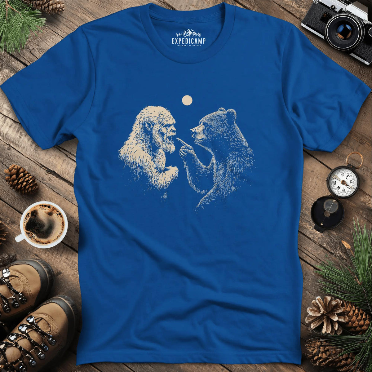 Bear and Bigfoot Argument T-Shirt – Wilderness Debate – Royal – Outdoor apparel for travel, hiking, camping, and nature lovers – ExpediCamp