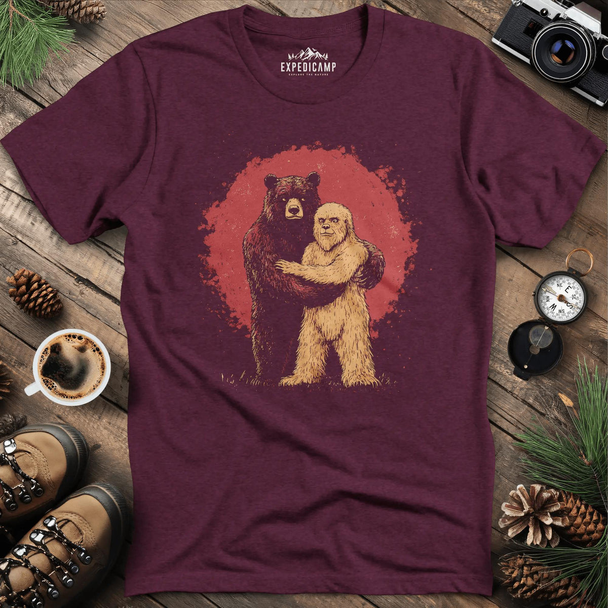 Bear Hugging Bigfoot T-Shirt – Unlikely Wilderness Friendship – Heather Maroon – Outdoor apparel for travel, hiking, camping, and nature lovers – ExpediCamp