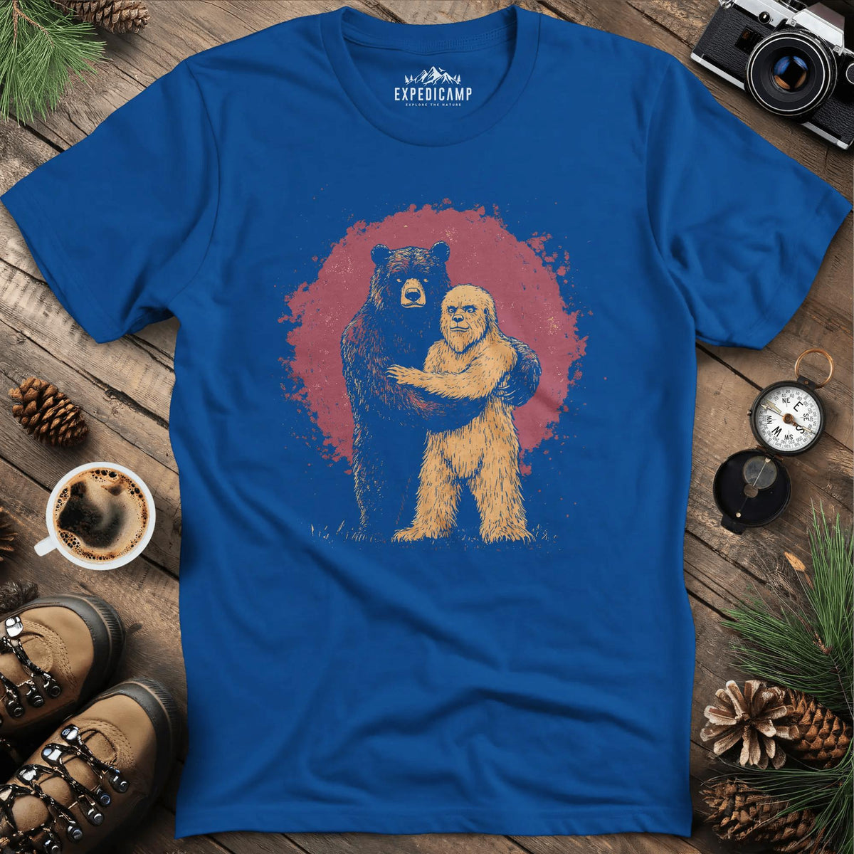 Bear Hugging Bigfoot T-Shirt – Unlikely Wilderness Friendship – Royal – Outdoor apparel for travel, hiking, camping, and nature lovers – ExpediCamp