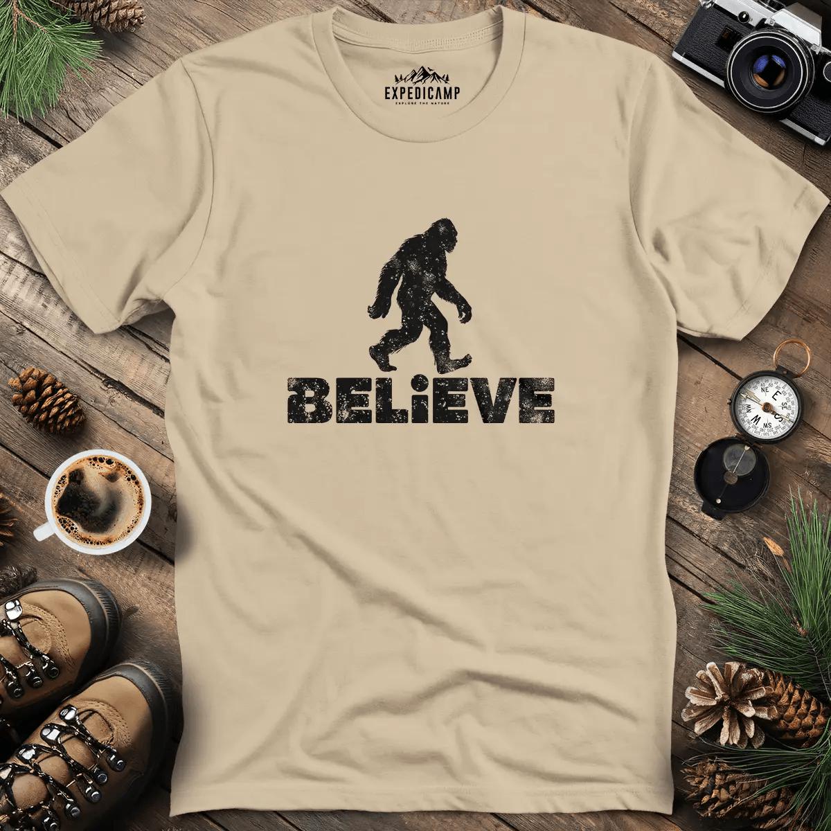 Believe Bigfoot T-Shirt – Sand – Outdoor apparel for travel, hiking, camping, and nature lovers – ExpediCamp