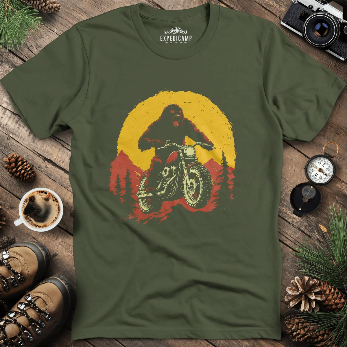 Bigfoot Riding Motorcycle T-Shirt – Bigfoot on the Open Road – Military Green – Outdoor apparel for travel, hiking, camping, and nature lovers – ExpediCamp
