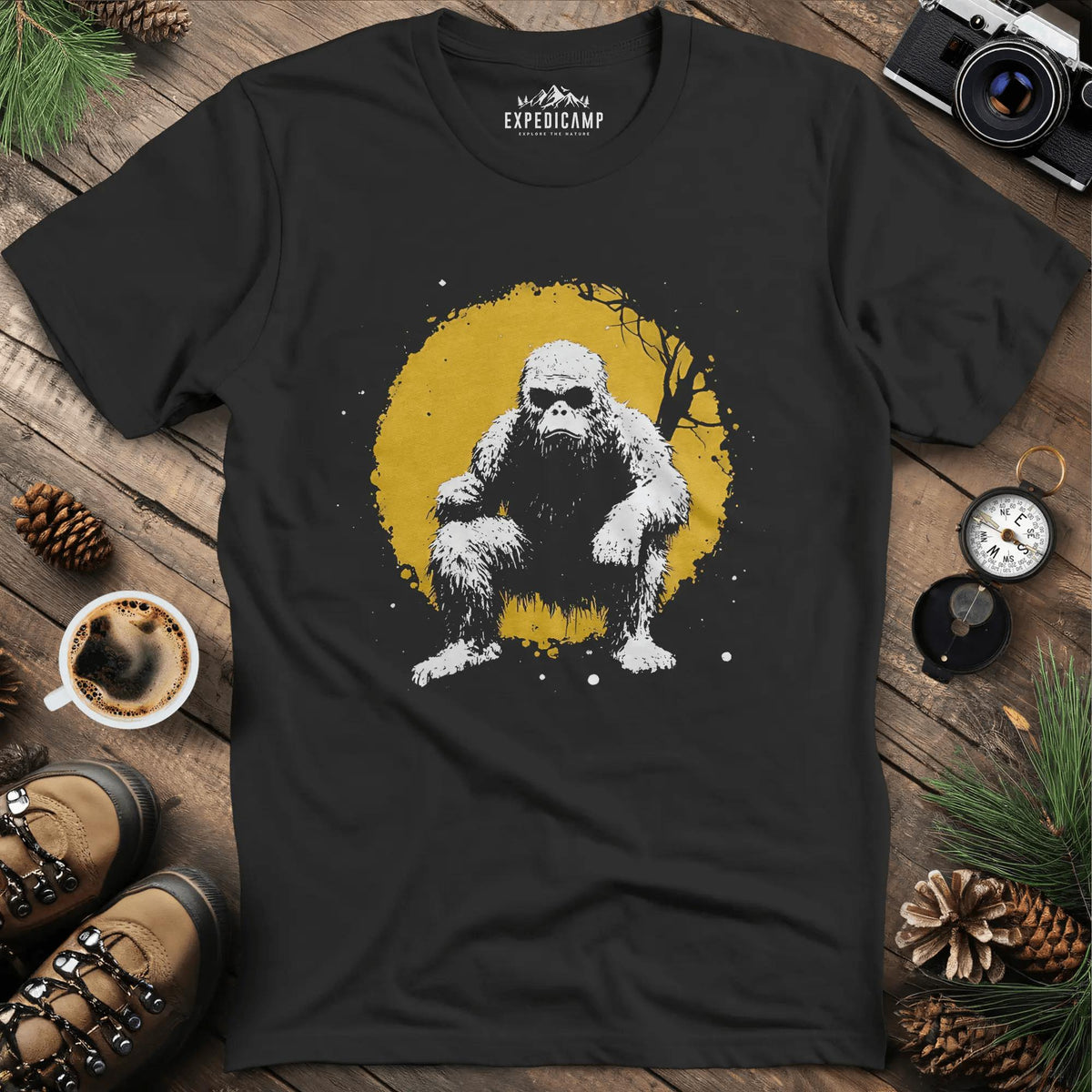 Bigfoot Swinging from a Tree T-Shirt – Adventurous Sasquatch Design – Black – Outdoor apparel for travel, hiking, camping, and nature lovers – ExpediCamp