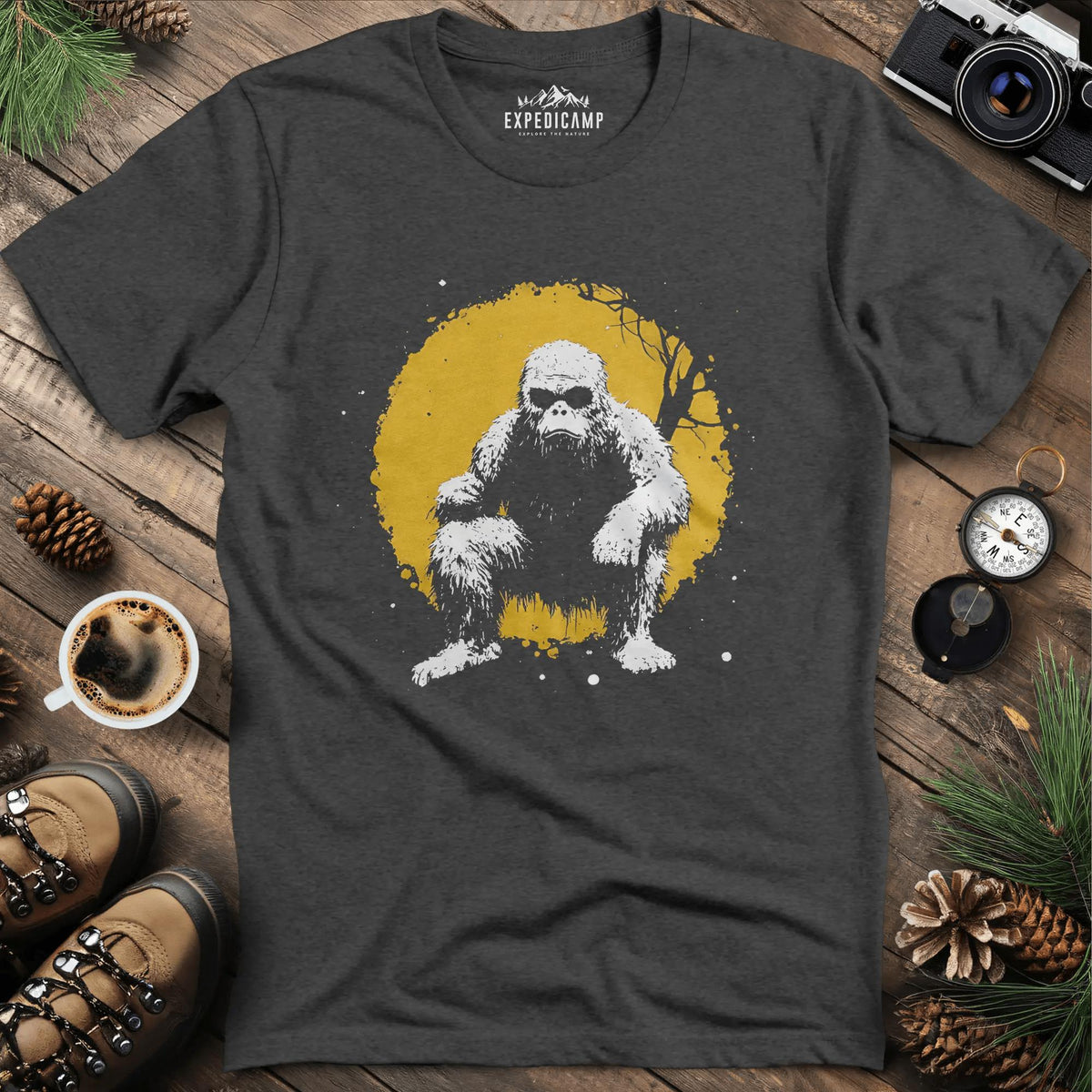 Bigfoot Swinging from a Tree T-Shirt – Adventurous Sasquatch Design – Dark Heather – Outdoor apparel for travel, hiking, camping, and nature lovers – ExpediCamp