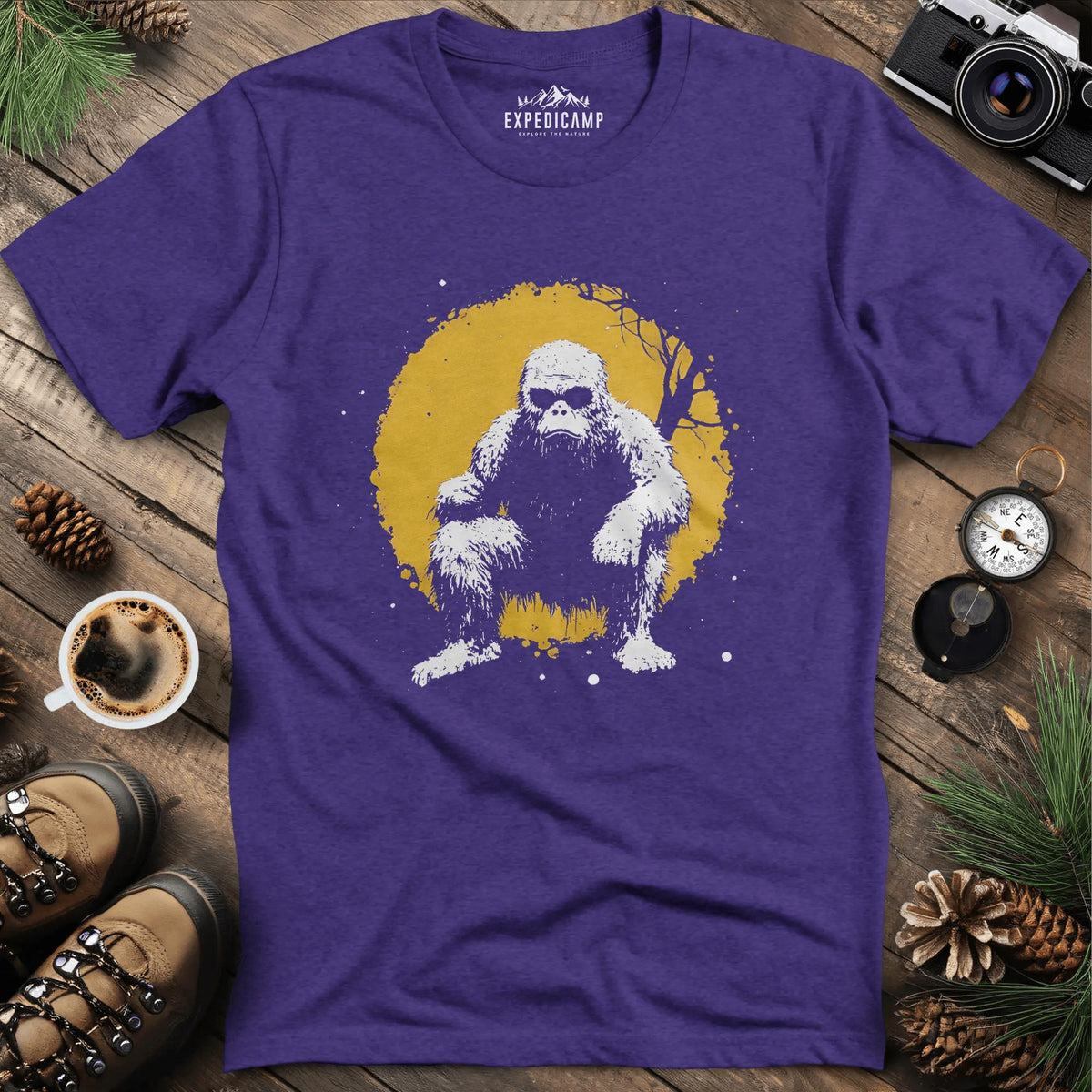 Bigfoot Swinging from a Tree T-Shirt – Adventurous Sasquatch Design – Heather Purple – Outdoor apparel for travel, hiking, camping, and nature lovers – ExpediCamp