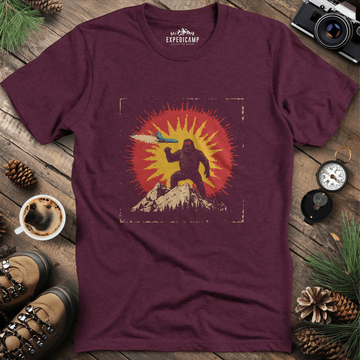 Bigfoot vs. The Skies T-Shirt – Heather Maroon – Outdoor apparel for travel, hiking, camping, and nature lovers – ExpediCamp