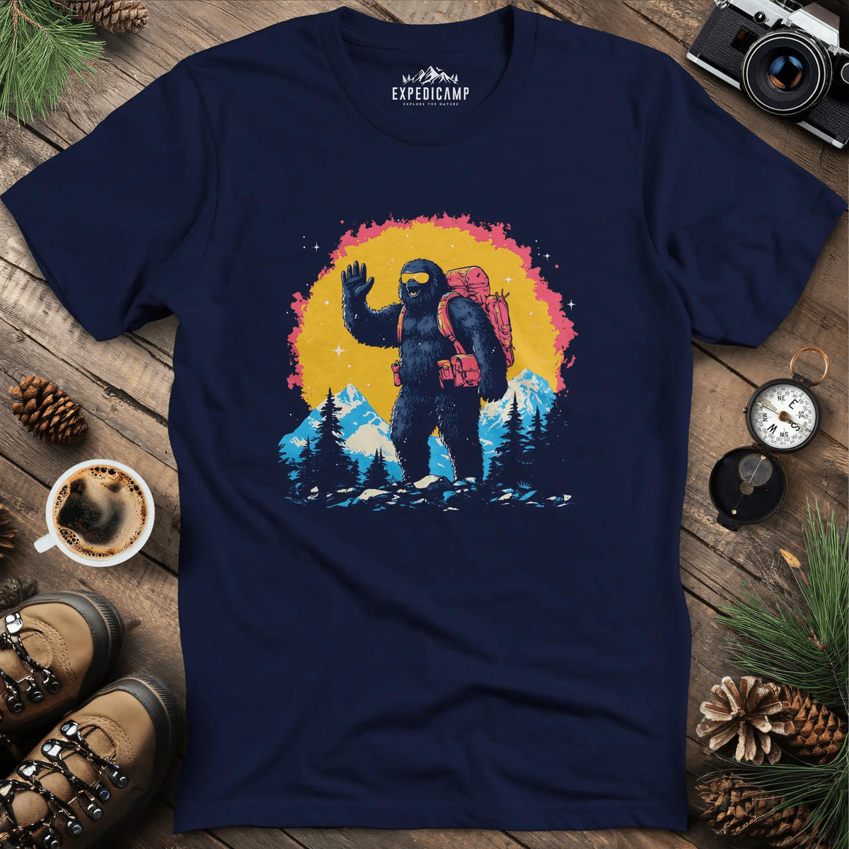 Bigfoot Waving T-Shirt – Friendly Sasquatch in the Mountains – Navy – Outdoor apparel for travel, hiking, camping, and nature lovers – ExpediCamp