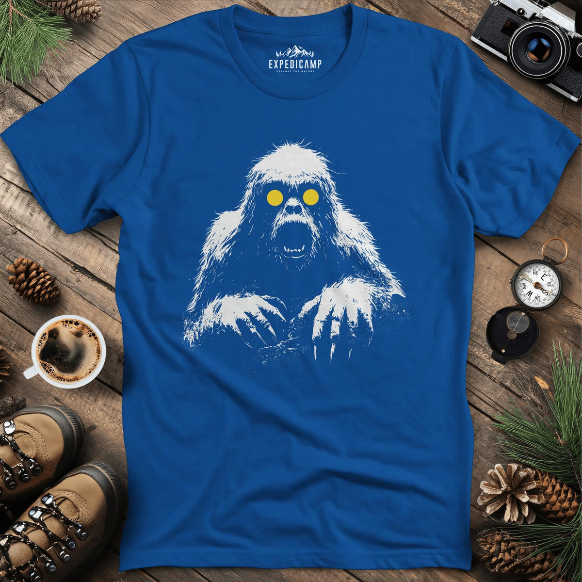 Bigfoot with Glowing Eyes T-Shirt – Mysterious Creature in the Dark – Royal – Outdoor apparel for travel, hiking, camping, and nature lovers – ExpediCamp