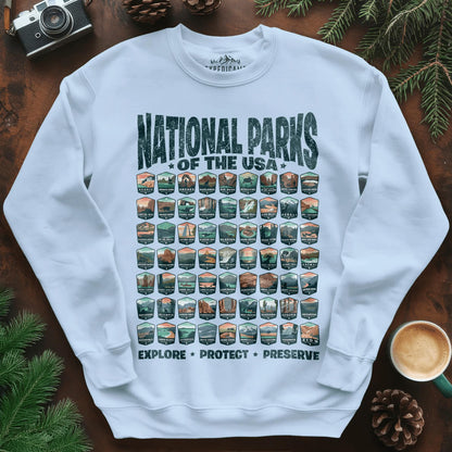 Explore All 63 National Parks of the USA Sweatshirt – Light Blue – Outdoor apparel for travel, hiking, camping, and nature lovers – ExpediCamp