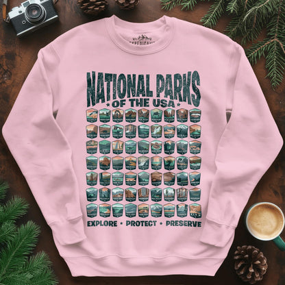 Explore All 63 National Parks of the USA Sweatshirt – Light Pink – Outdoor apparel for travel, hiking, camping, and nature lovers – ExpediCamp