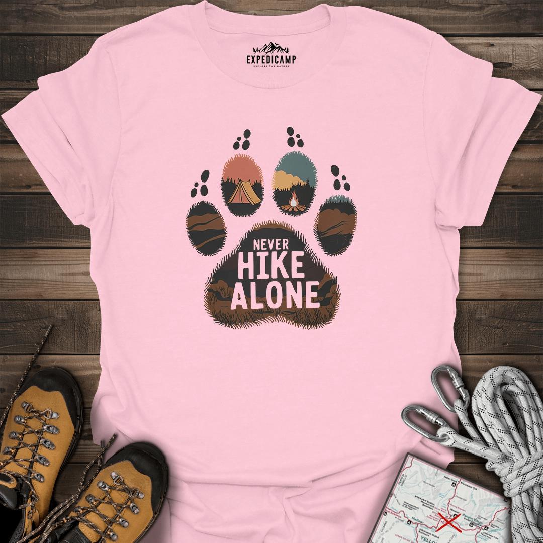 Never Hike Alone T-Shirt – Light Pink – Outdoor apparel for travel, hiking, camping, and nature lovers – ExpediCamp