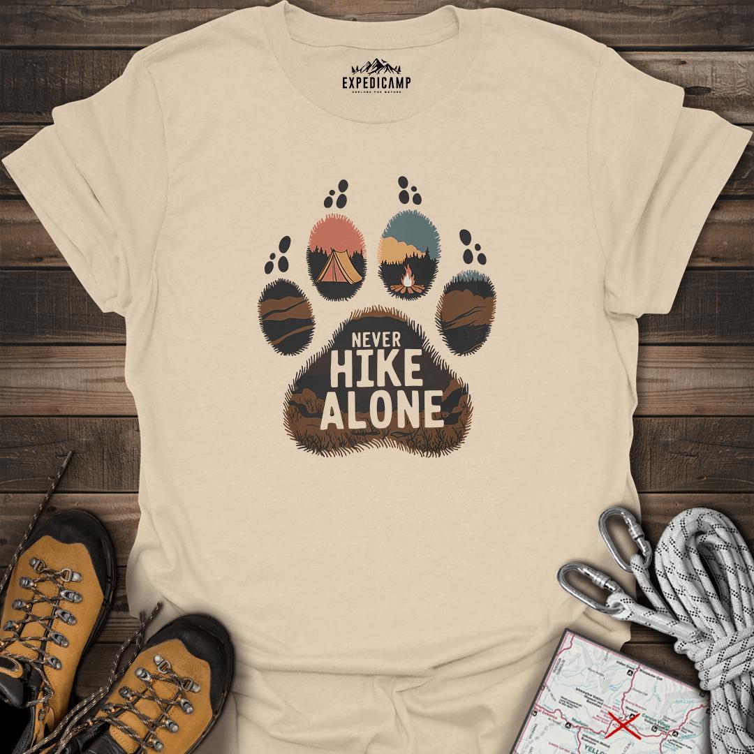 Never Hike Alone T-Shirt – Sand – Outdoor apparel for travel, hiking, camping, and nature lovers – ExpediCamp