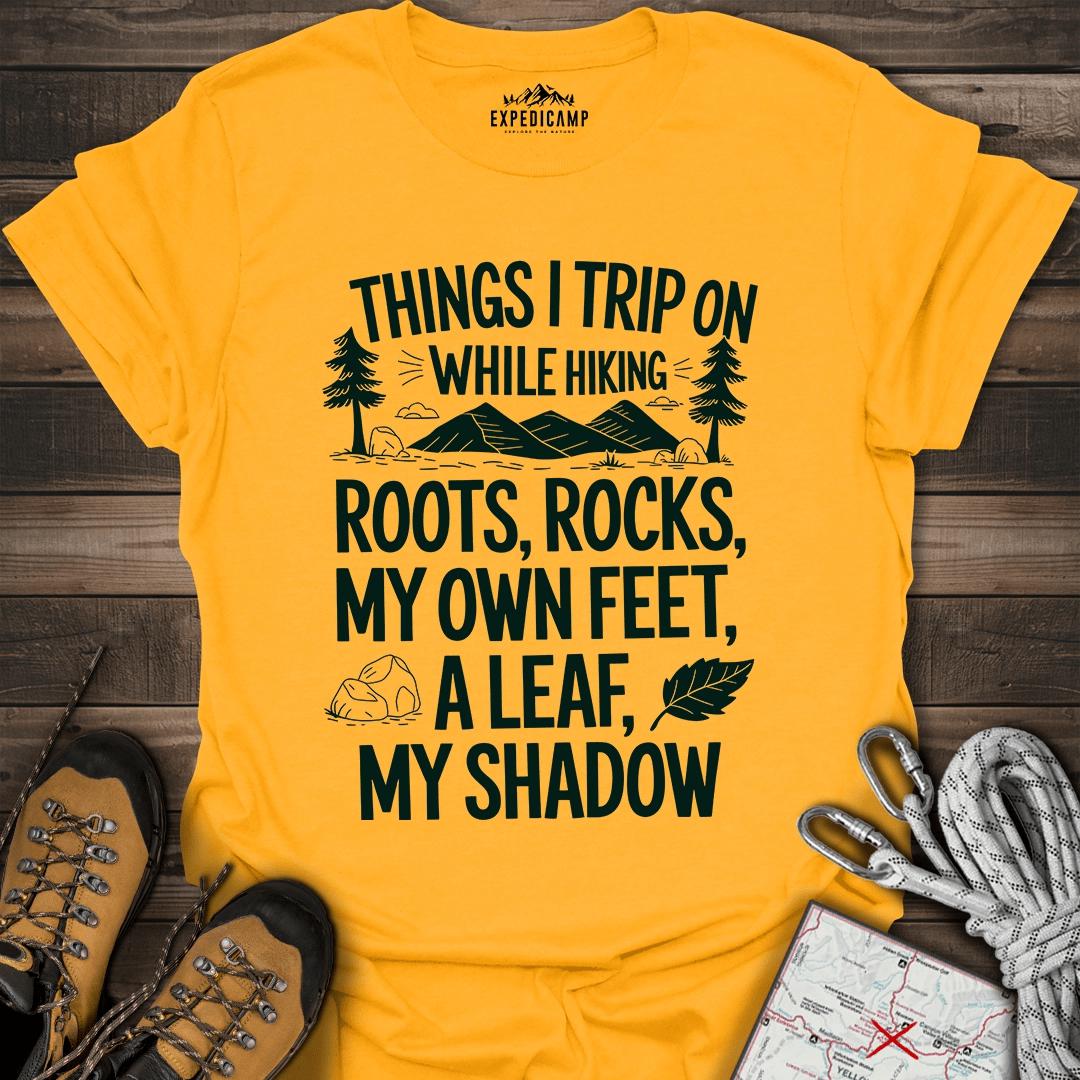 Things I Trip On While Hiking T-Shirt – Gold – Outdoor apparel for travel, hiking, camping, and nature lovers – ExpediCamp