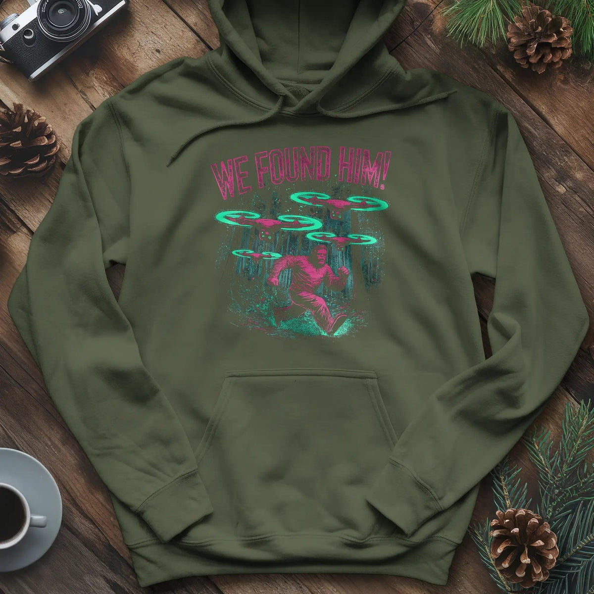 We Found Him Bigfoot Hoodie – Military Green – Outdoor apparel for travel, hiking, camping, and nature lovers – ExpediCamp